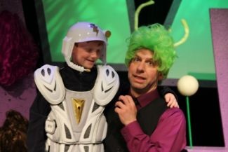 Kenn Adams dressed in outer space costume with child also dressed up