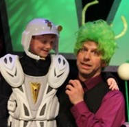 Kenn Adams dressed in outer space costume with child also dressed up