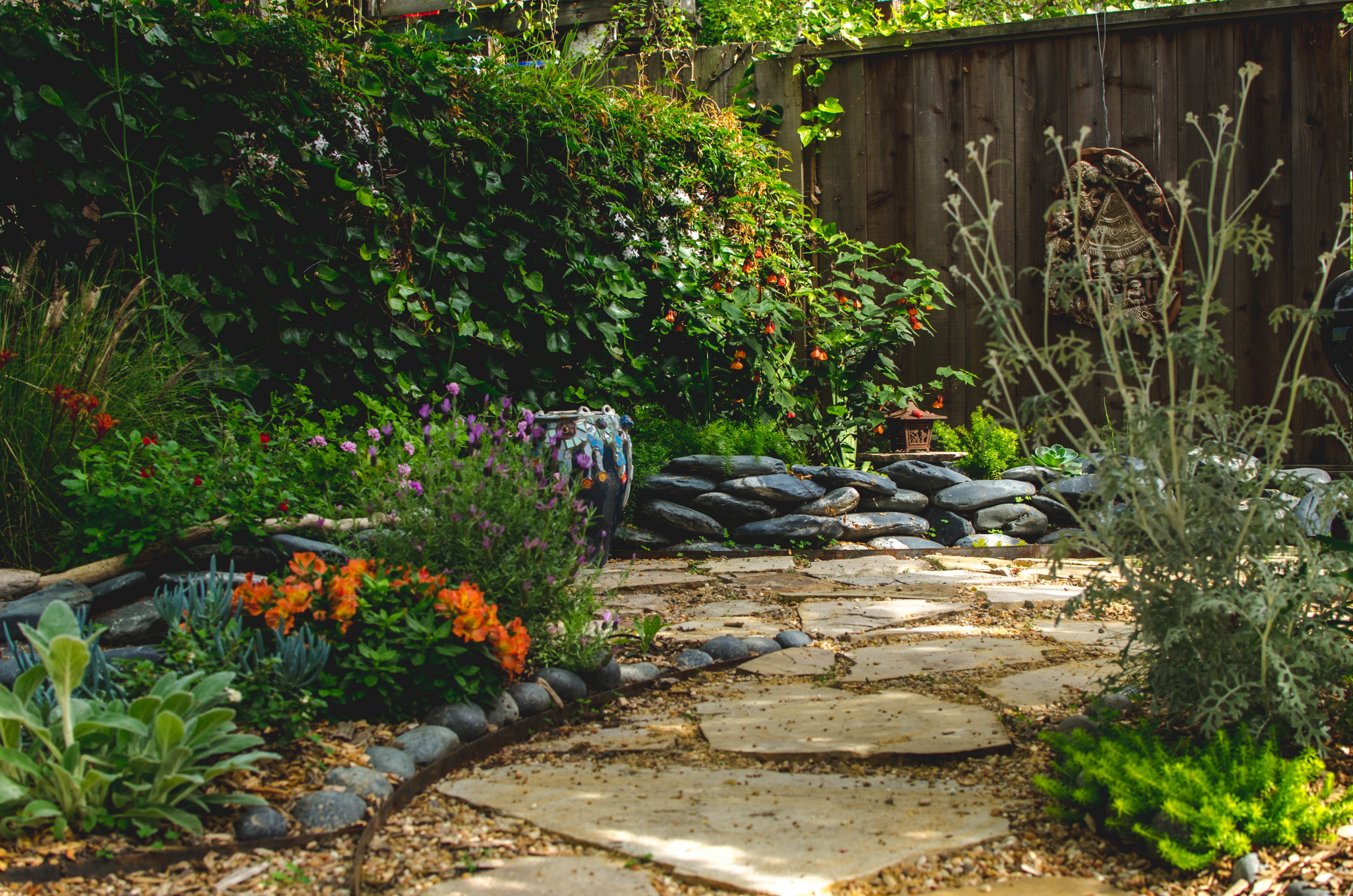 picture of a garden with stone pathways