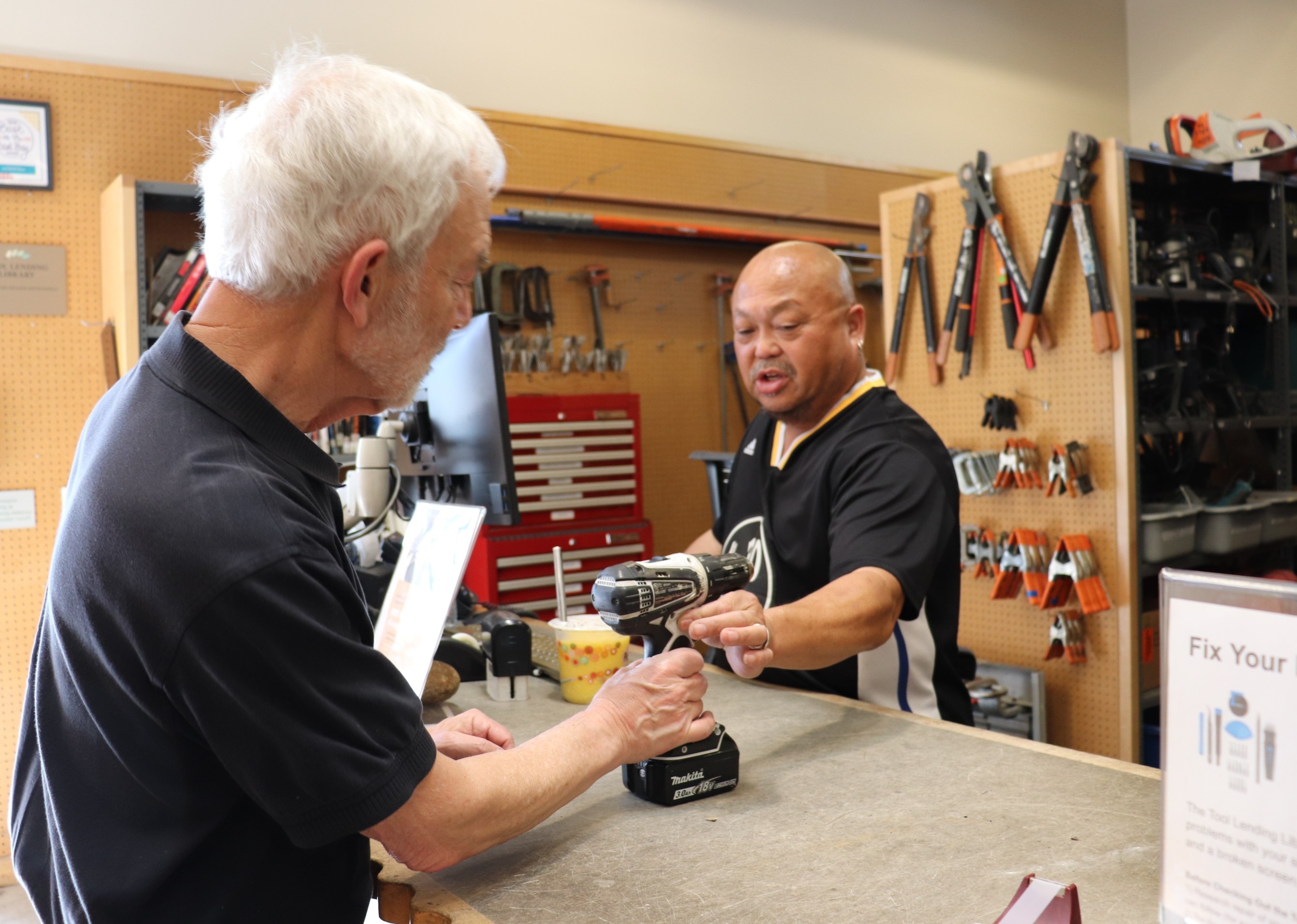 Patron and Library staff at the Tool Lending Library