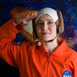 female actor wearing astronaut outfit