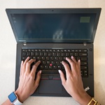 Close Up of Hands on a Laptop Keyboard
