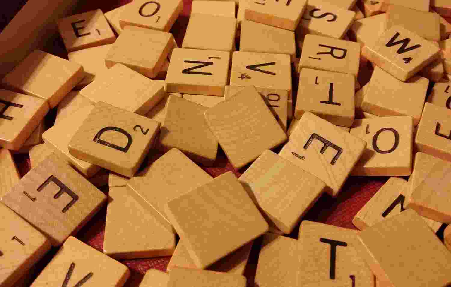 Scrabble tiles piled atop one another