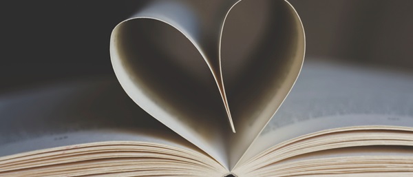 Open book with pages folded to make a heart shape