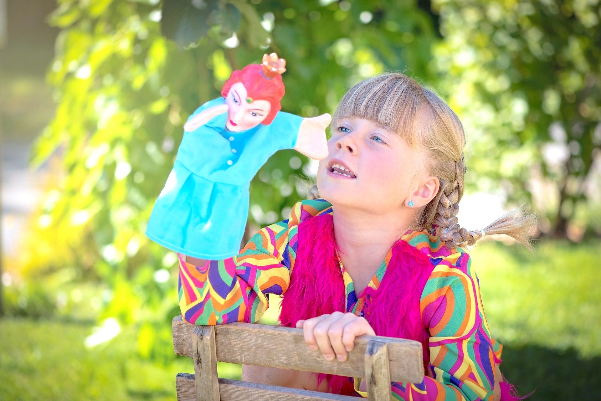 Child Reading a Book Outdoors in the Fall
