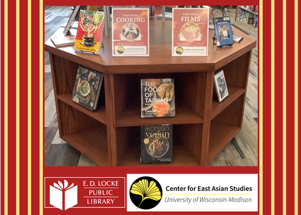 Picture of a book display in the library with various East Asian cookbooks and DVDs against a red background with vertical yellow stripes along the sides and logos for E.D. Locke Public Library and Center for UW-Madison East Asian Studies at the bottom.