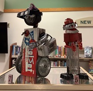 Picture of robots made of recycled materials on top of display case