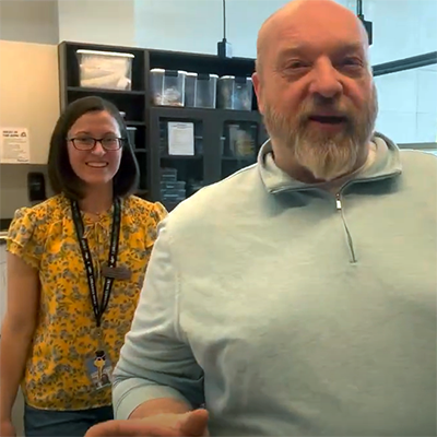 Radio host, Dan Kyle, from B93.3 FM, with Claire, from Menomonee Falls Public Library, on a tour