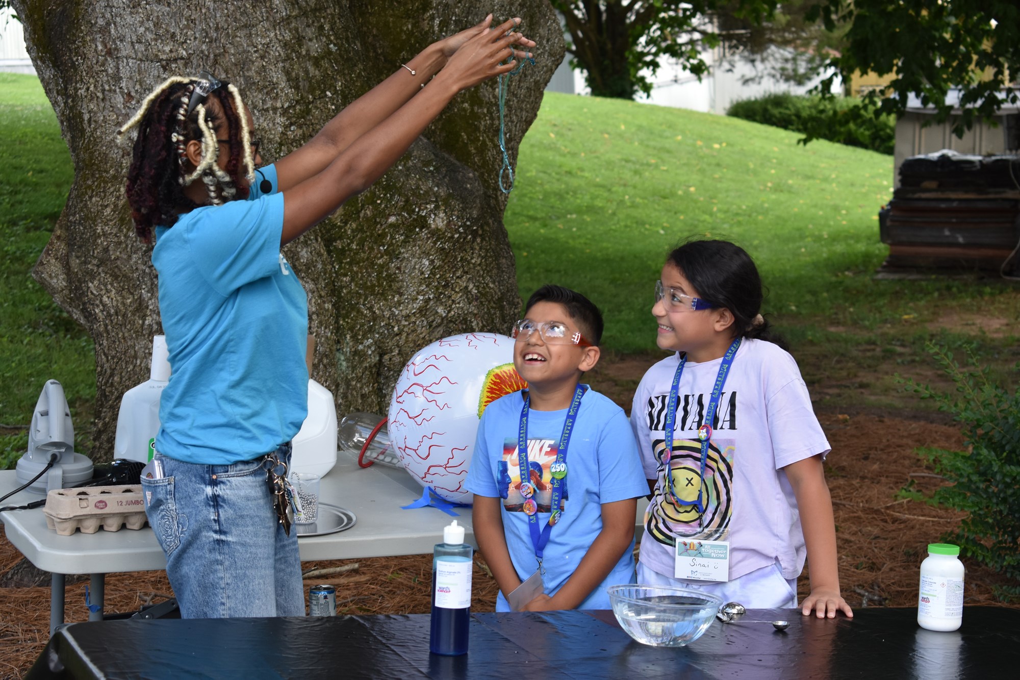 Two children with astounded looks on their faces during a science experiment at a recent FCPL Bookmobile stop. 