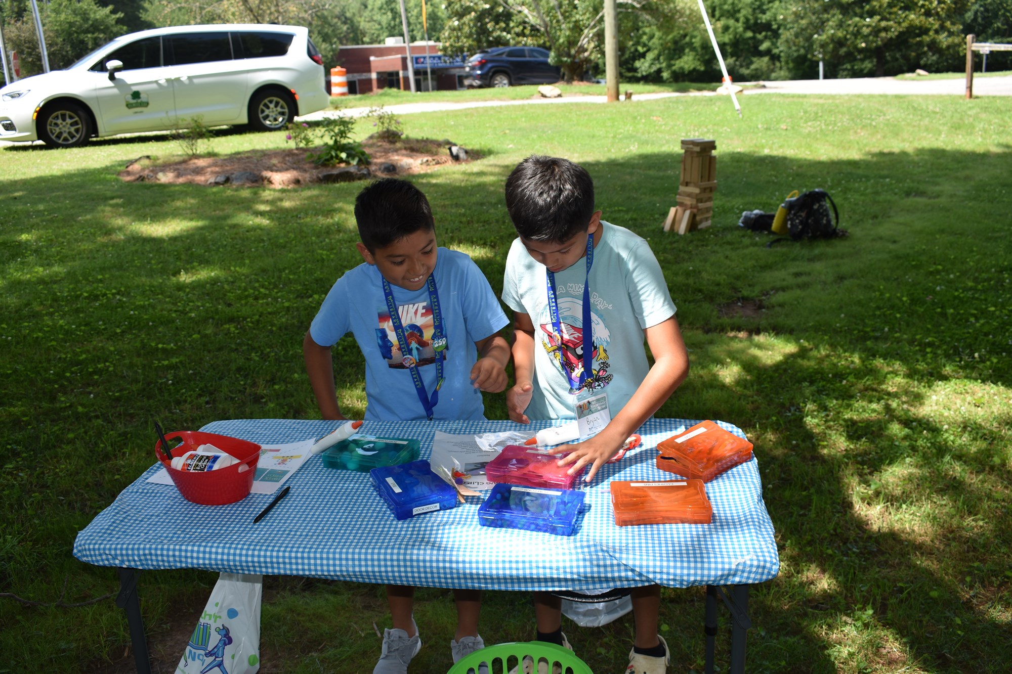 Two tween boys enjoying a craft project at a recent FCPL Bookmobile stop. 