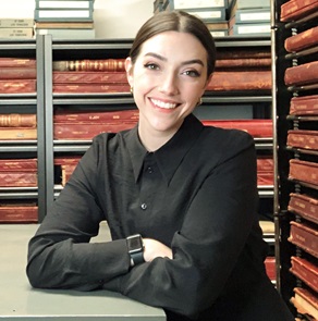Photo of Alyssa Ballard sitting at a desk