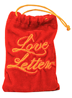 Photograph of a red velvet bag with text that reads "Love Letter" 