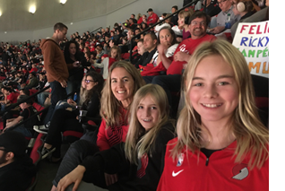 Photo of Max and family at a Blazer game