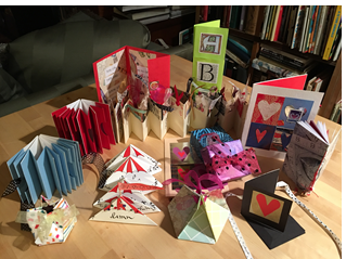 Photo of an assortment of books, boxes, and cards created by art teacher Diane Flack