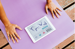 Photo of a tablet on a yoga mat