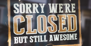 Sign reading, "Sorry, we're closed, but still awesome."