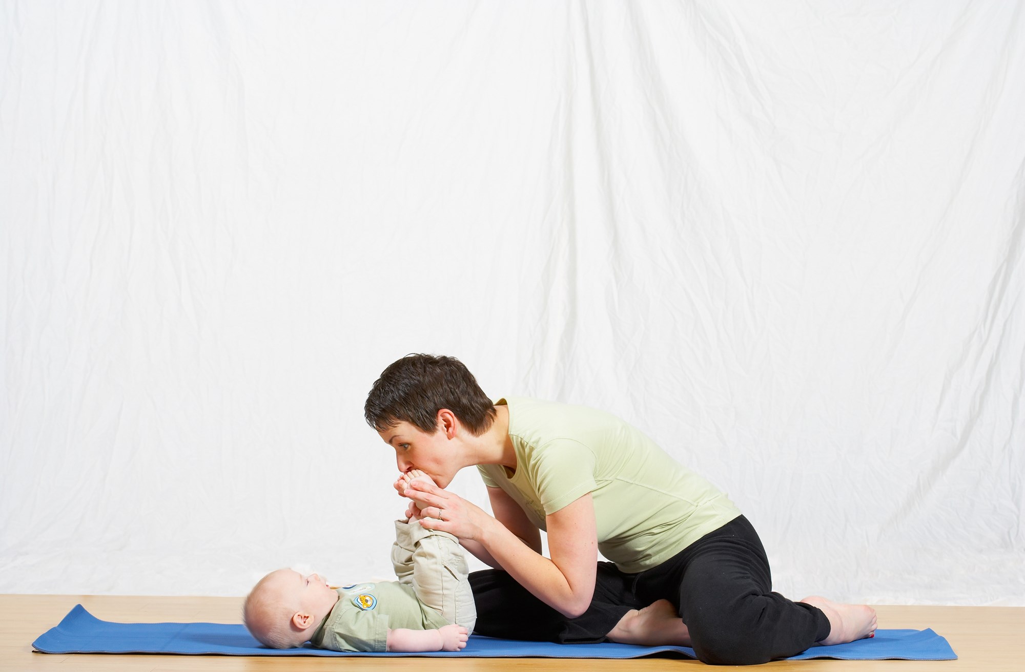 mother and child doing yoga