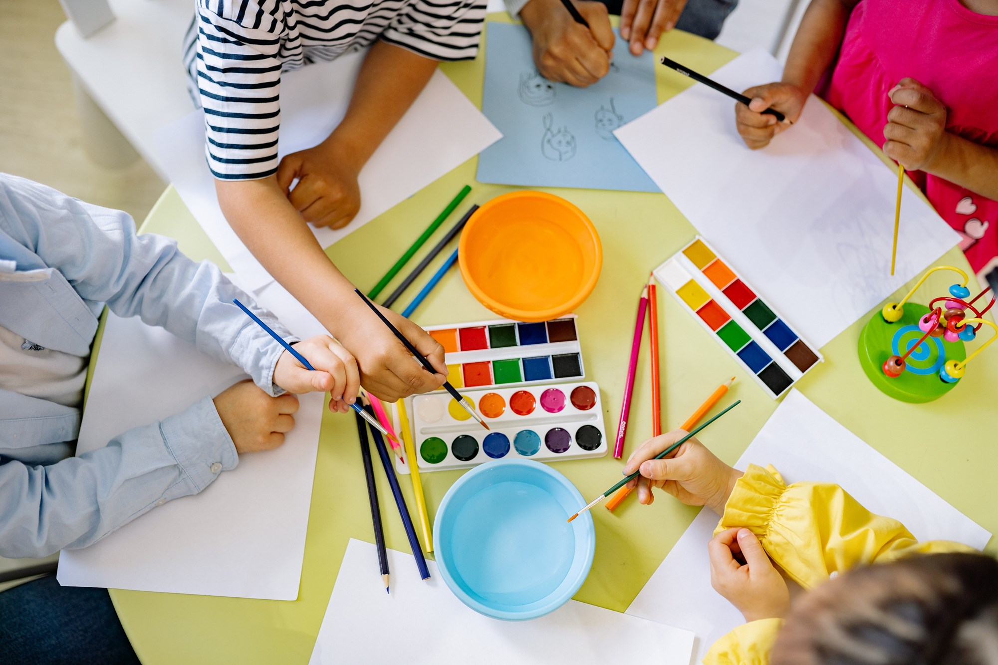 children painting with water colors