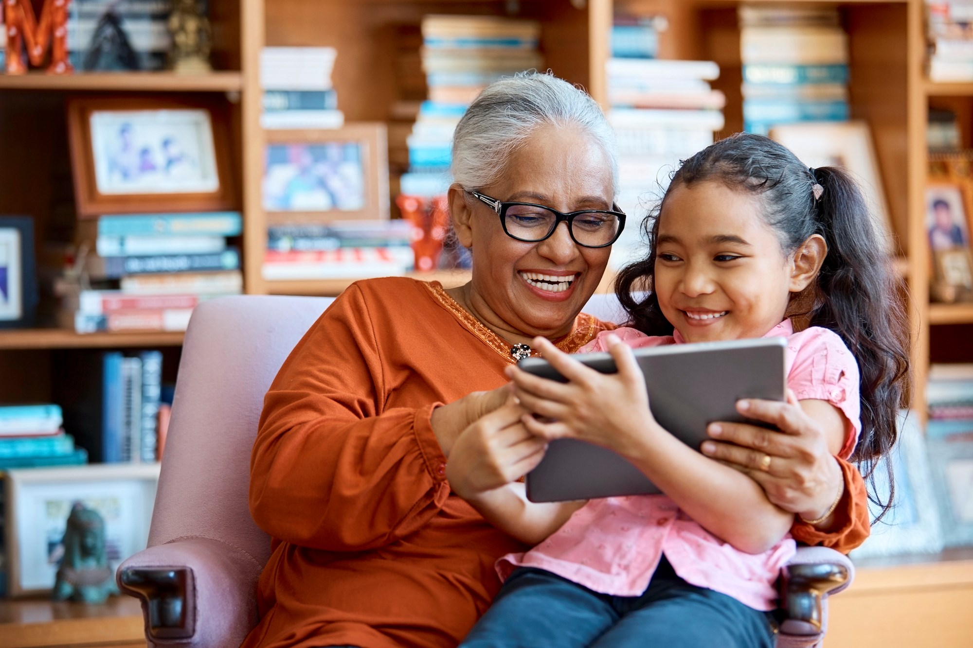 Senior woman reading to child