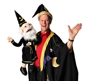 Magician Lorenzo the Great dressed like a wizard and holding a wizard puppet