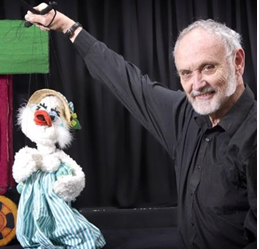 photo of Bob Brown holding a Mother Goose puppet