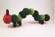 a knitted Hungry Hungry caterpiller