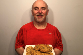 Chef Rob holding a plate of Cowboy Cookies