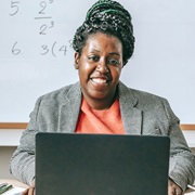 Smiling woman in a computer class.