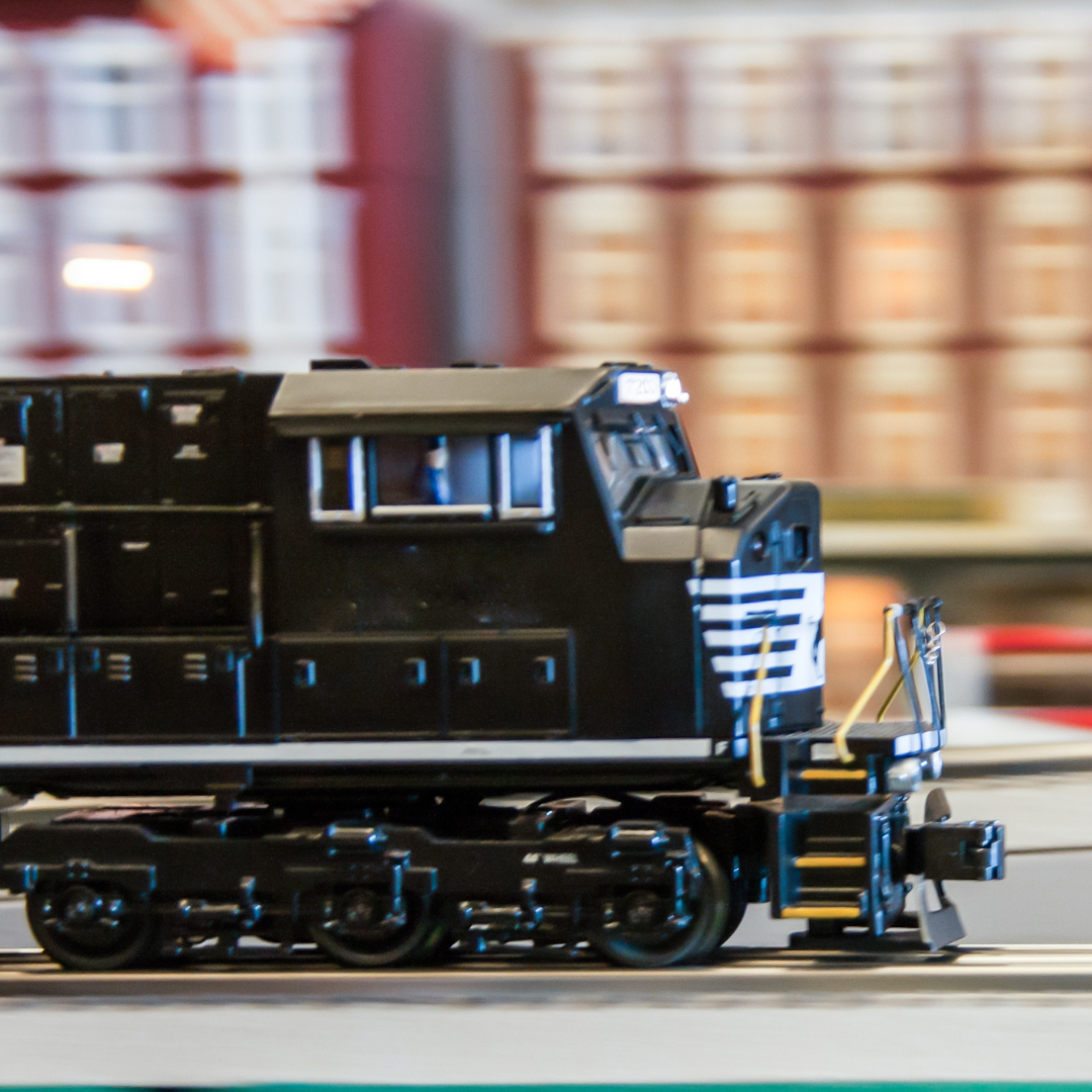 Photo of a toy train on a track.