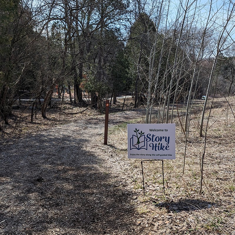 Photo of the Story Hike sign at Retzer Nature Centers trail.