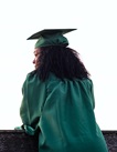 Photo of a young woman wearing a graduation cap and gown.