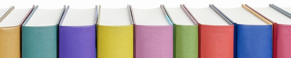 Multi-colored book spines in a row