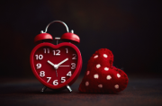 clock on a table with leaves