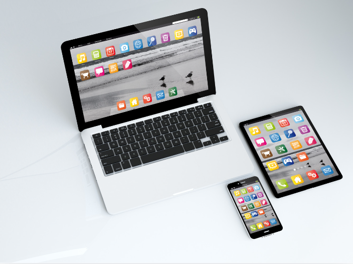 Photograph of laptop, iPad and phone