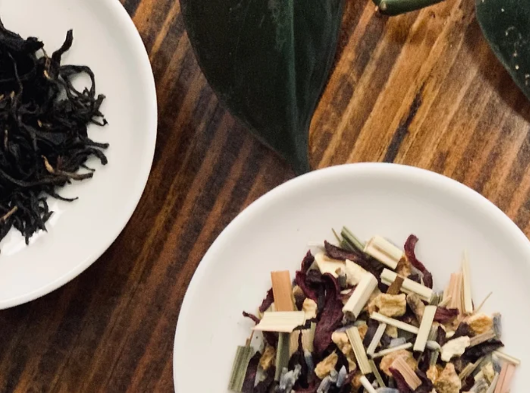 A photograph of bowls containing various flavours of loose-leaf tea.