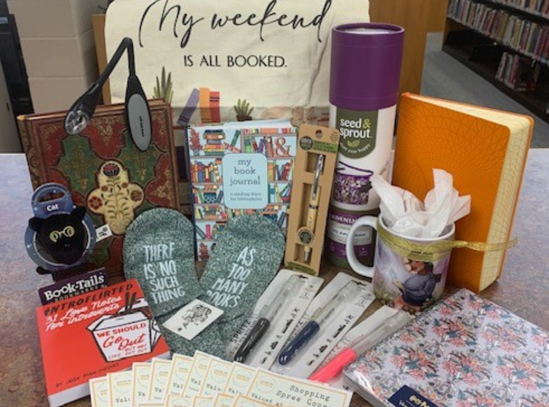 A selection of prizes for the adult book bingo, including notebooks, 
