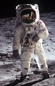 Photo of astronaut in space suit standing on the Moon