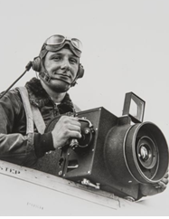 Sonoma County photographer Don Meacham on board of his plane holding a camera.
